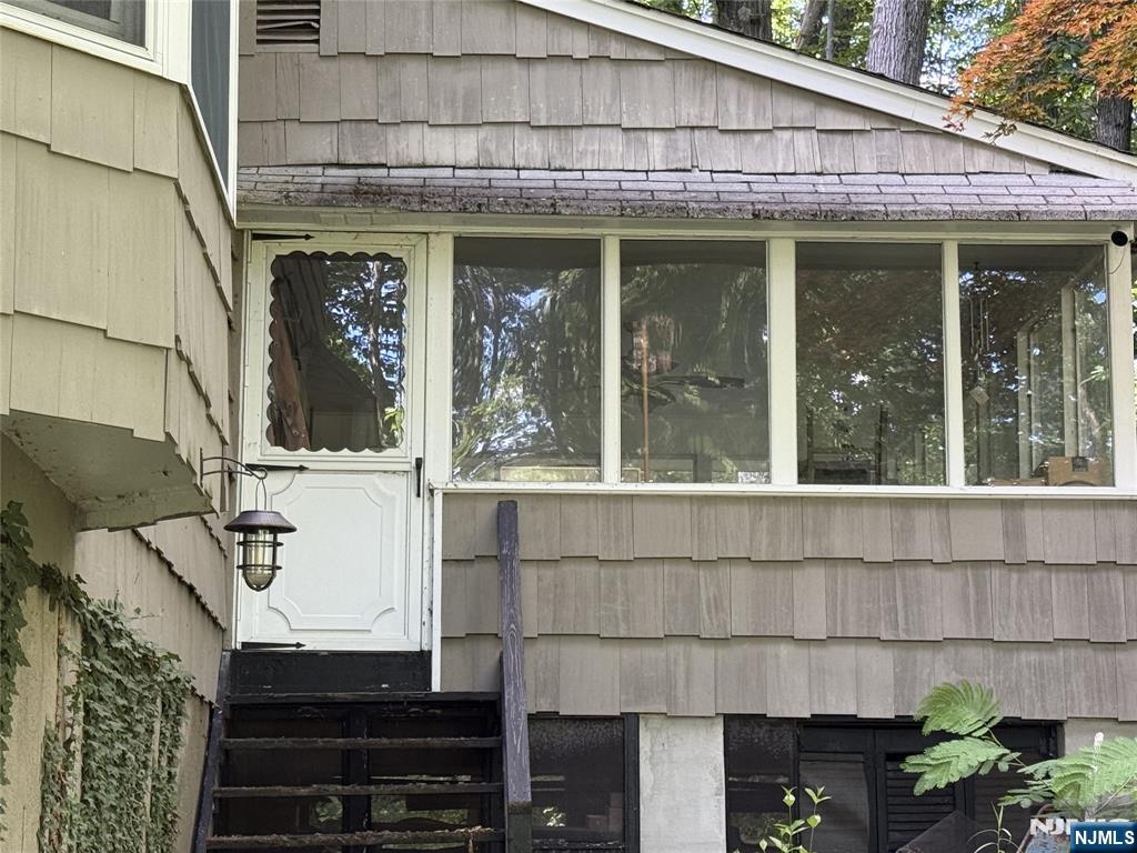 36 Lavina Trail Oak Ridge, NJ 07438 - Photo 6 of 26 a front view of a house with a garden