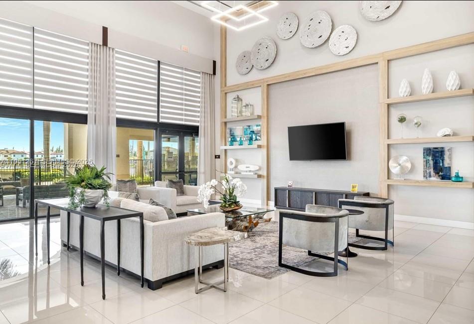 10306 West 33rd Lane Hialeah, FL 33018 - Photo 15 of 29 a living room with furniture and a flat screen tv