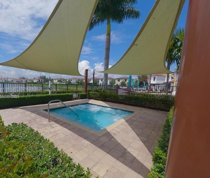 10306 West 33rd Lane Hialeah, FL 33018 - Photo 19 of 29 a view of a swimming pool with a patio