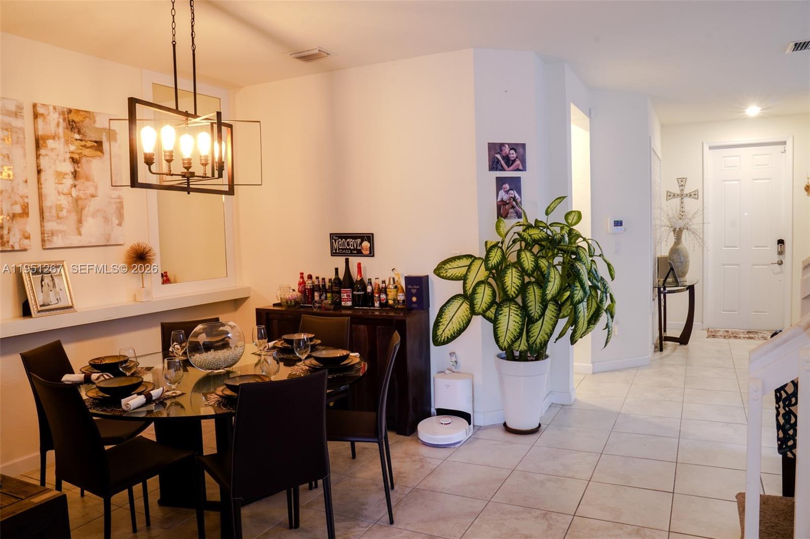 10306 West 33rd Lane Hialeah, FL 33018 - Photo 2 of 29 a view of a dining room with furniture