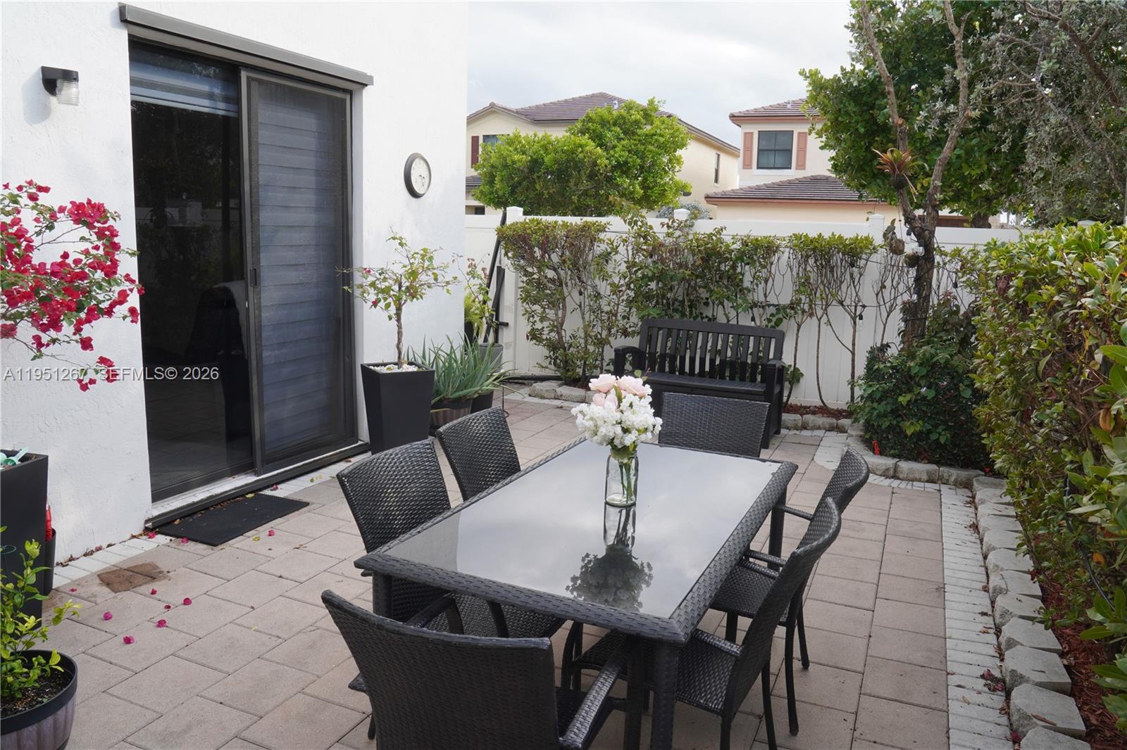 10306 West 33rd Lane Hialeah, FL 33018 - Photo 4 of 29 a view of backyard of a house with seating space