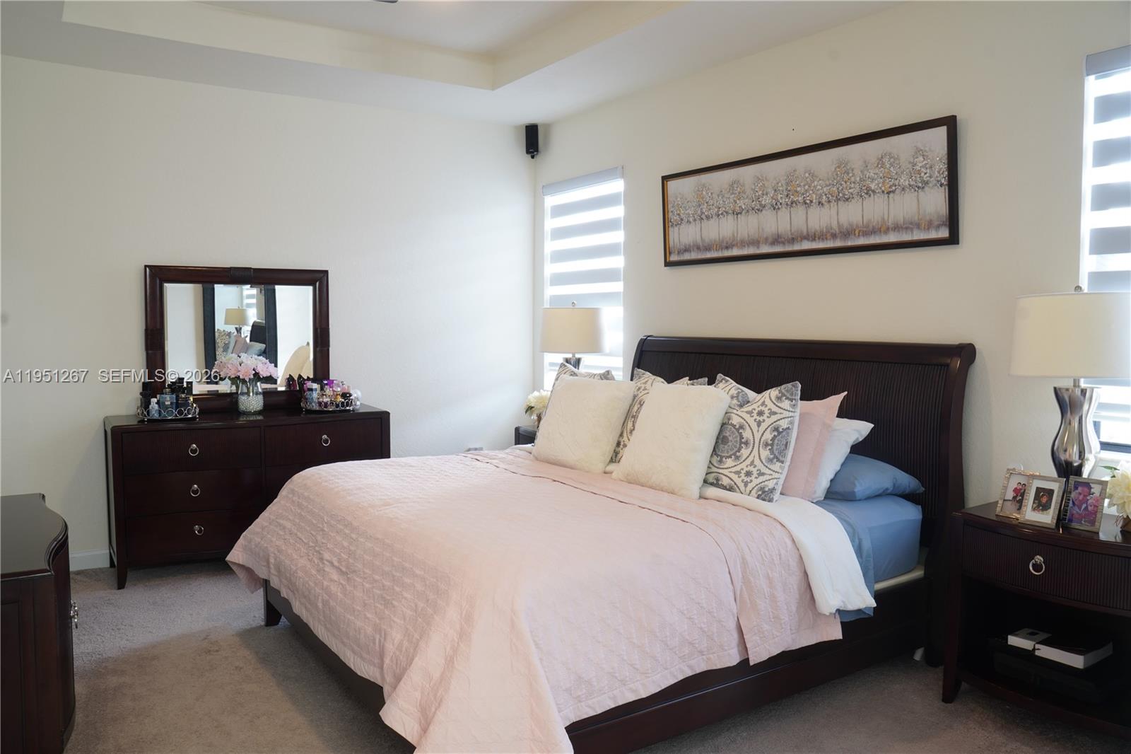 10306 West 33rd Lane Hialeah, FL 33018 - Photo 7 of 29 a bedroom with a bed and a mirror