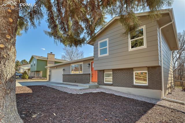 1913 Wooten Road Colorado Springs, CO 80915 - Photo 9 of 50 Tri-level home with a garage