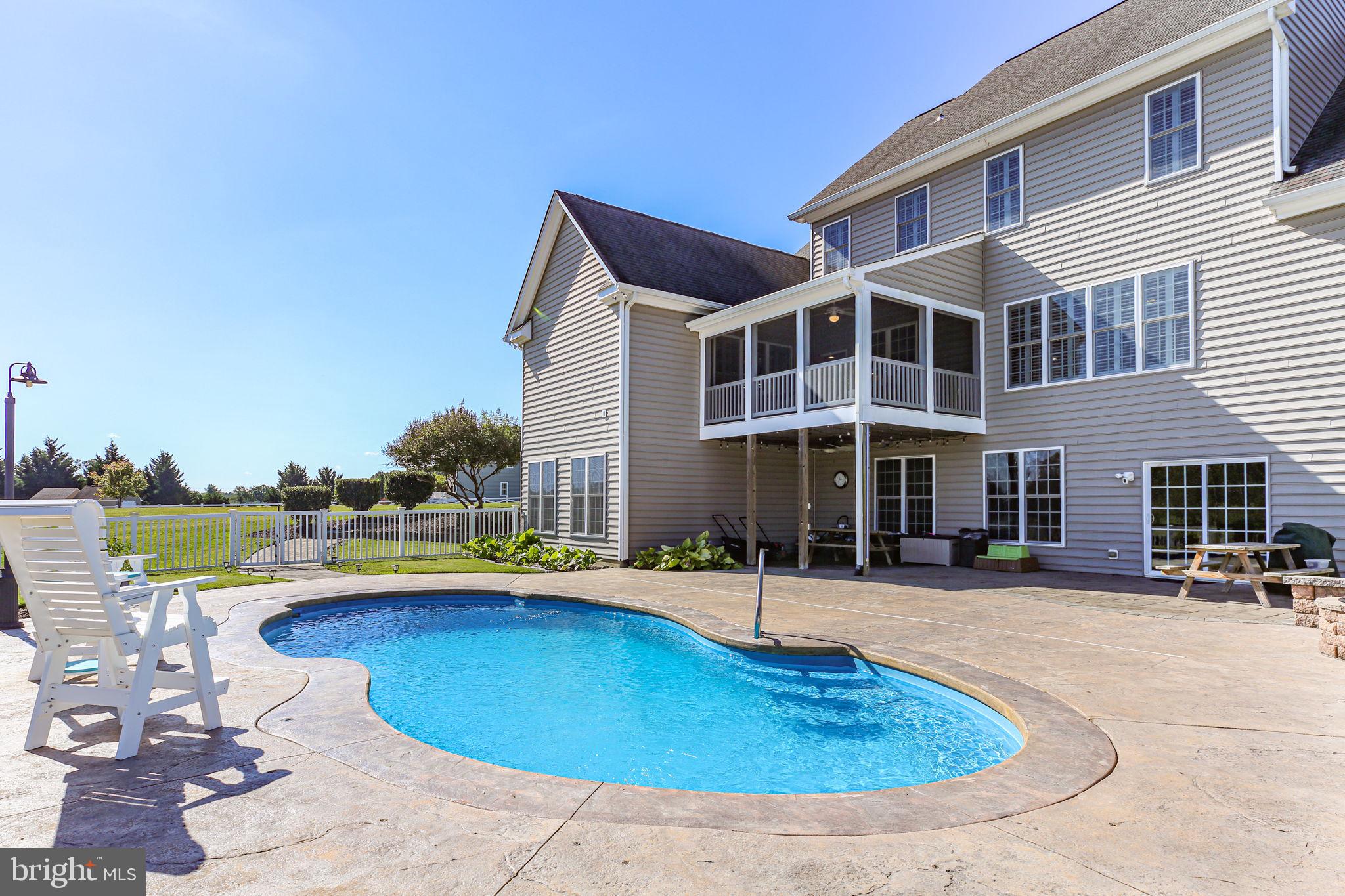 9910 Agnes Lane Spotsylvania, VA 22553 - Photo 105 of 106 a front view of a house with swimming pool having outdoor seating