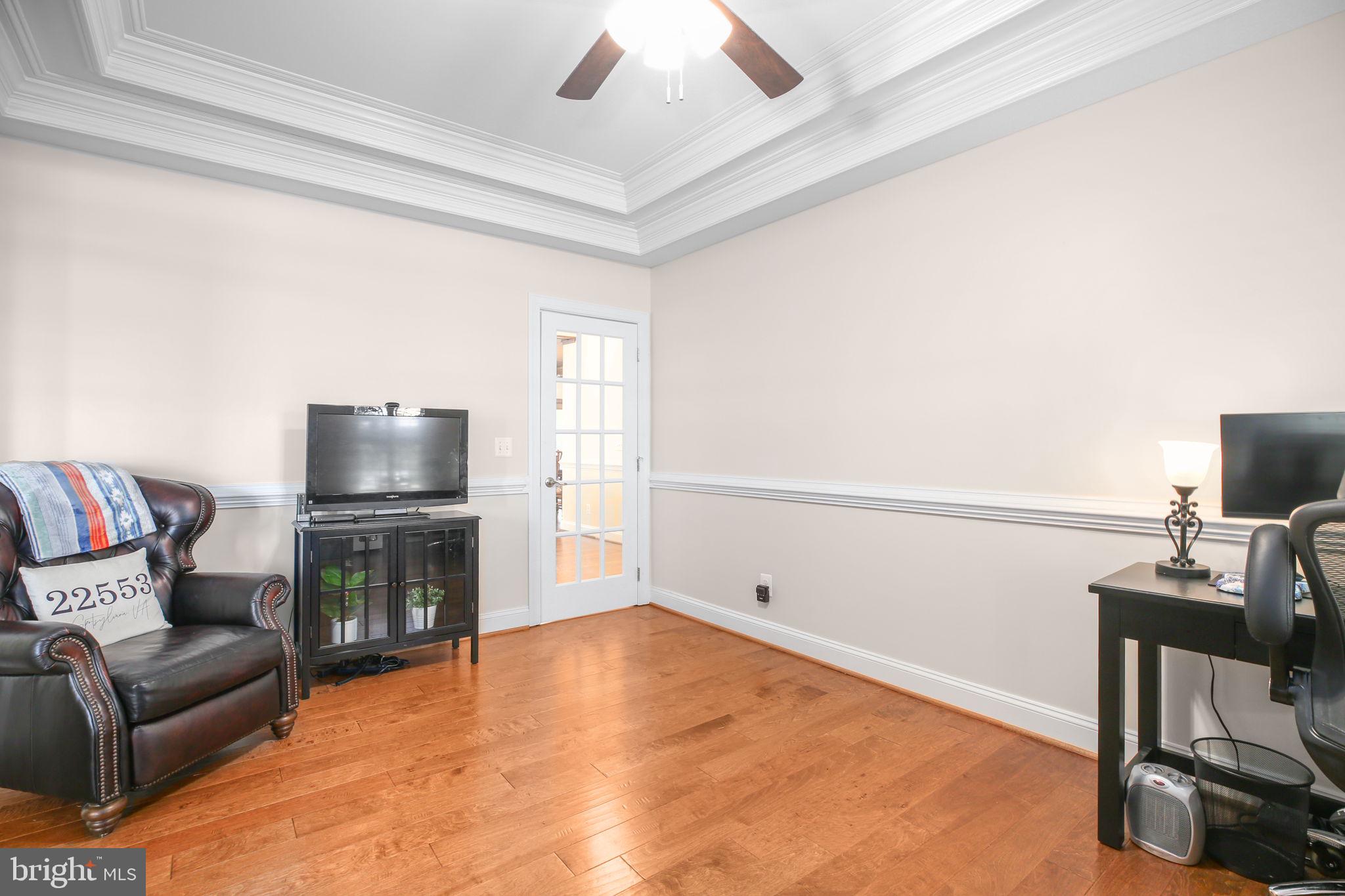 9910 Agnes Lane Spotsylvania, VA 22553 - Photo 11 of 106 a living room with furniture and a fireplace