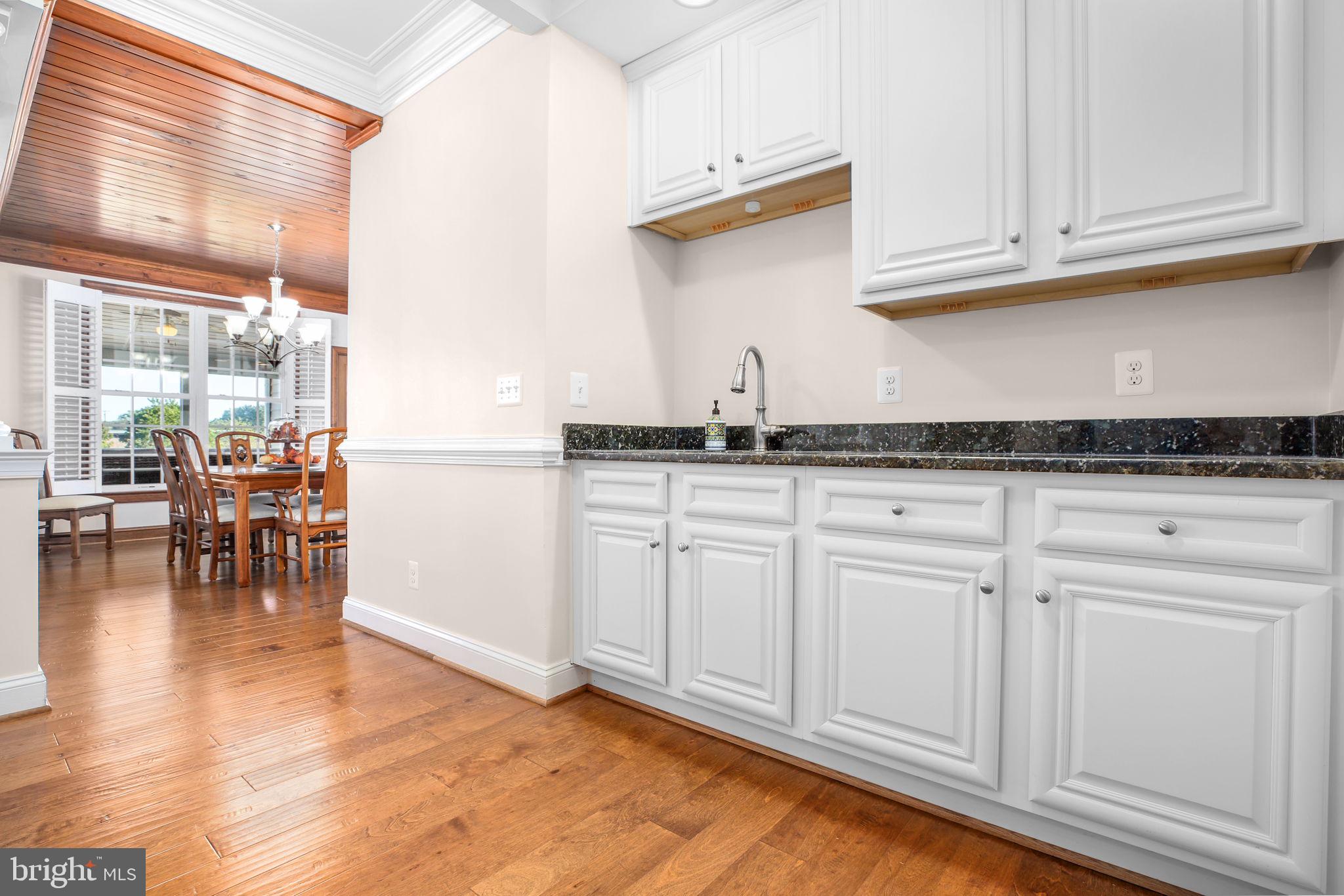 9910 Agnes Lane Spotsylvania, VA 22553 - Photo 14 of 106 a kitchen with granite countertop a sink and cabinets