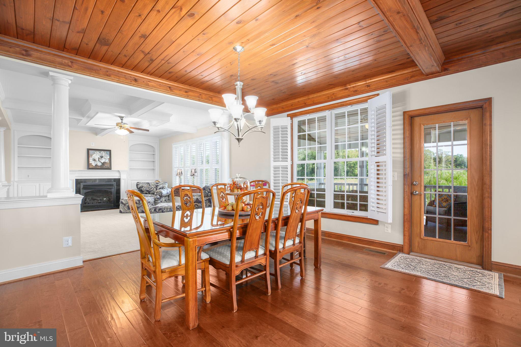 9910 Agnes Lane Spotsylvania, VA 22553 - Photo 19 of 106 a view of a dining room with furniture window and wooden floor