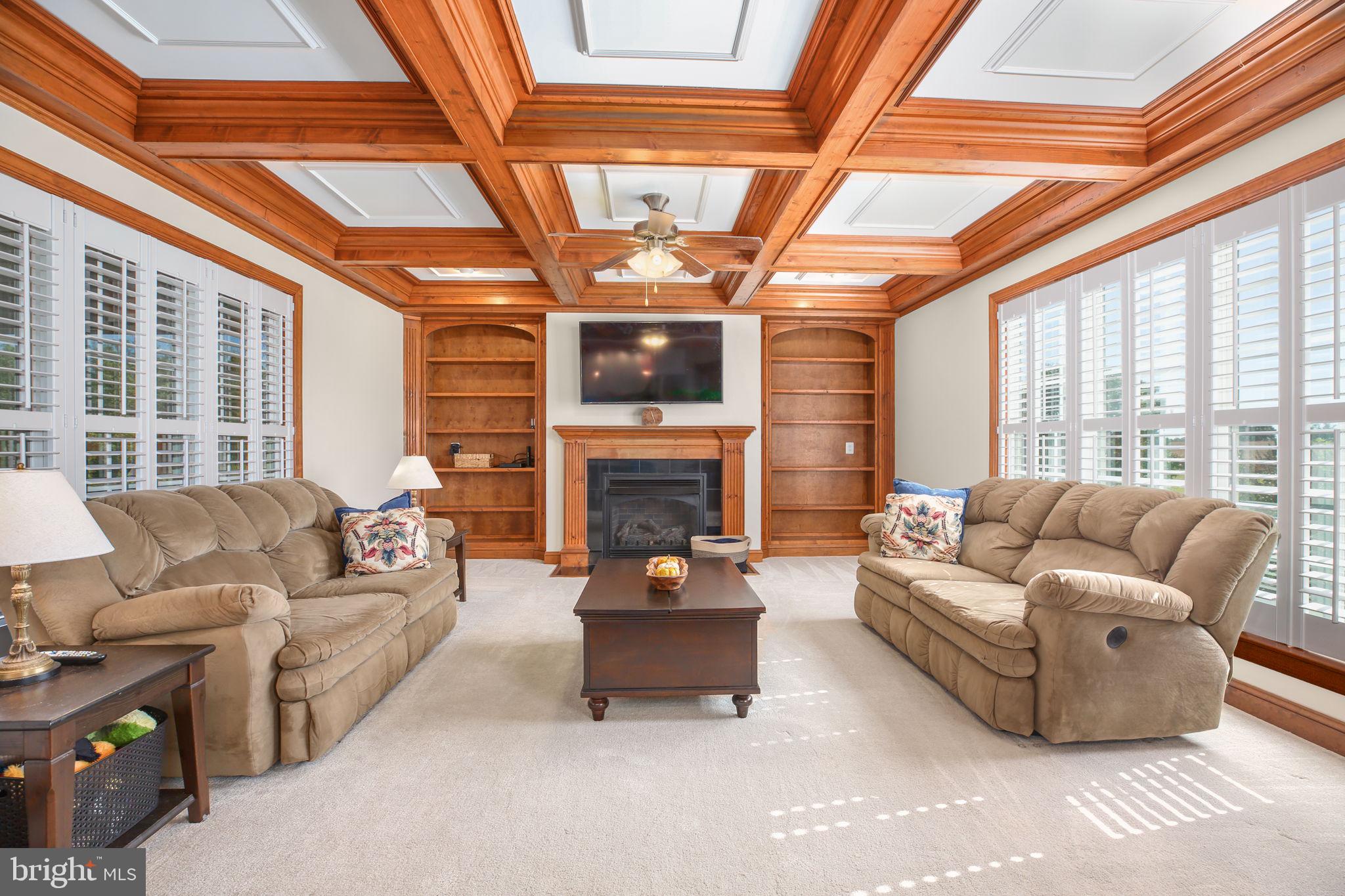 9910 Agnes Lane Spotsylvania, VA 22553 - Photo 24 of 106 a living room with furniture a fireplace and a large window