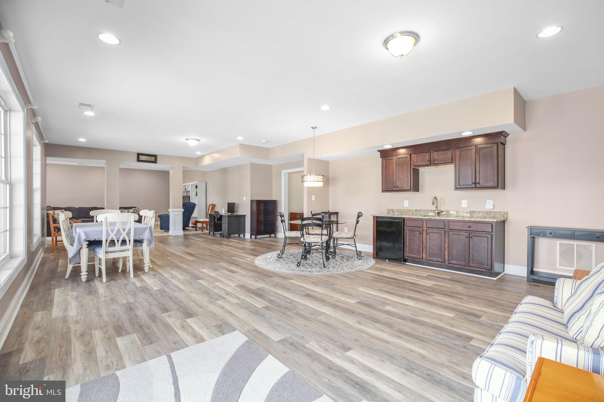 9910 Agnes Lane Spotsylvania, VA 22553 - Photo 61 of 106 a living room with furniture and kitchen view
