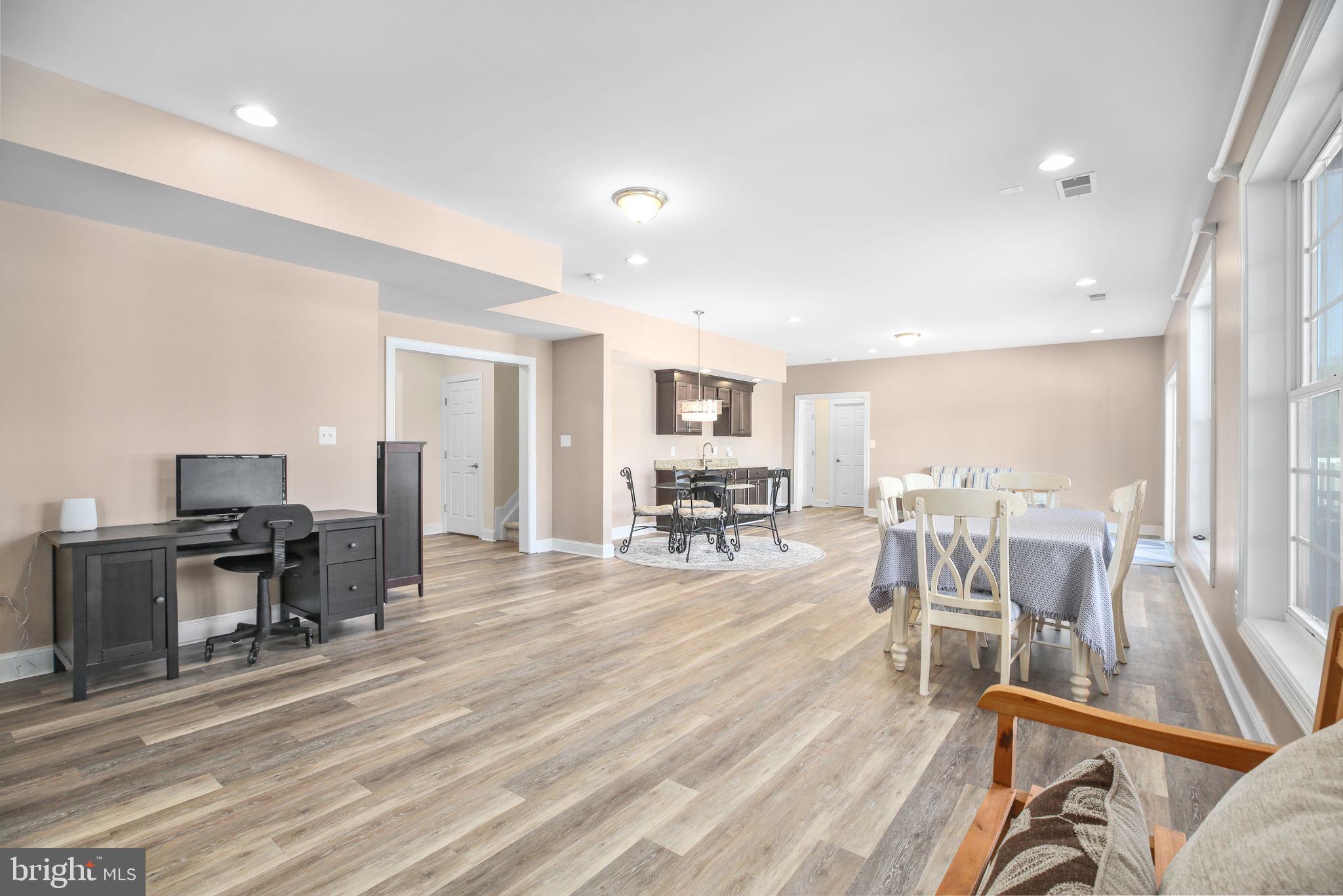 9910 Agnes Lane Spotsylvania, VA 22553 - Photo 63 of 106 a view of a workspace with furniture and a large window