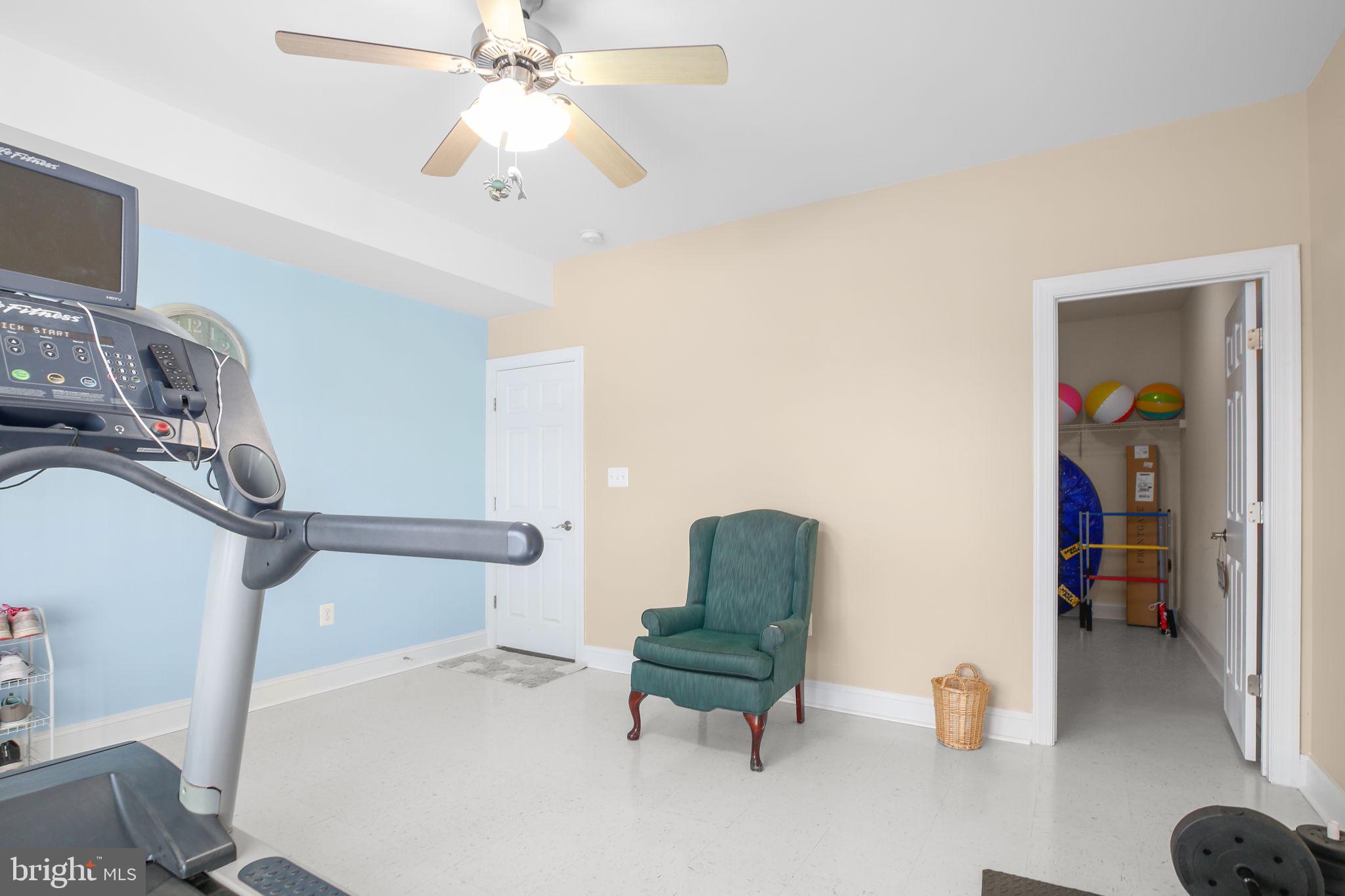 9910 Agnes Lane Spotsylvania, VA 22553 - Photo 69 of 106 a living room with furniture and a chandelier