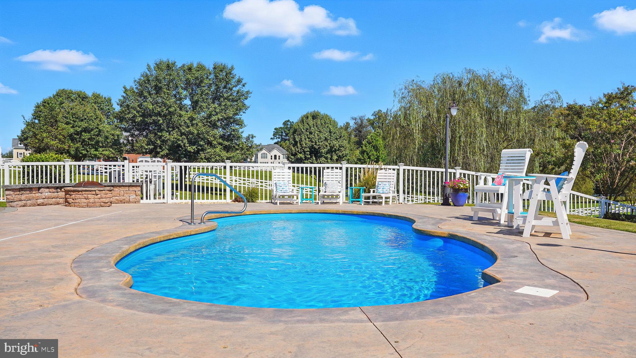 9910 Agnes Lane Spotsylvania, VA 22553 - Photo 86 of 106 a view of a swimming pool with a patio