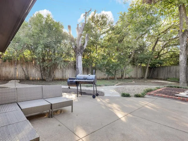 a view of a bench in a backyard
