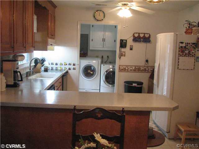 11278 Hanover Courthouse Road Hanover, VA 23069 - Photo 5 of 12 a kitchen with a refrigerator and a stove top oven