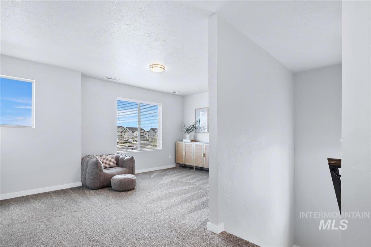 4215 North Pindus Avenue Meridian, ID 83646 - Photo 20 of 46 Sitting room featuring light colored carpet and lots of extra space for work or play
