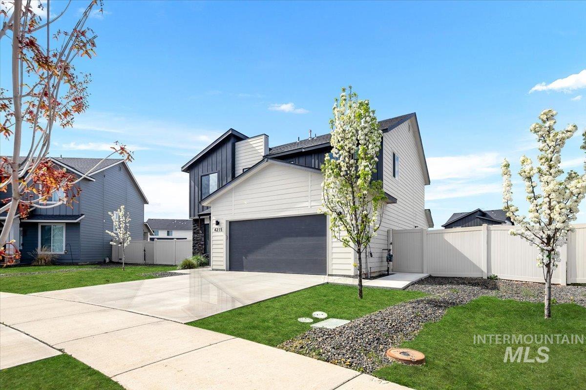 4215 North Pindus Avenue Meridian, ID 83646 - Photo 2 of 46 Contemporary house with a 3-car garage, board & batten and stone accents and large side yards