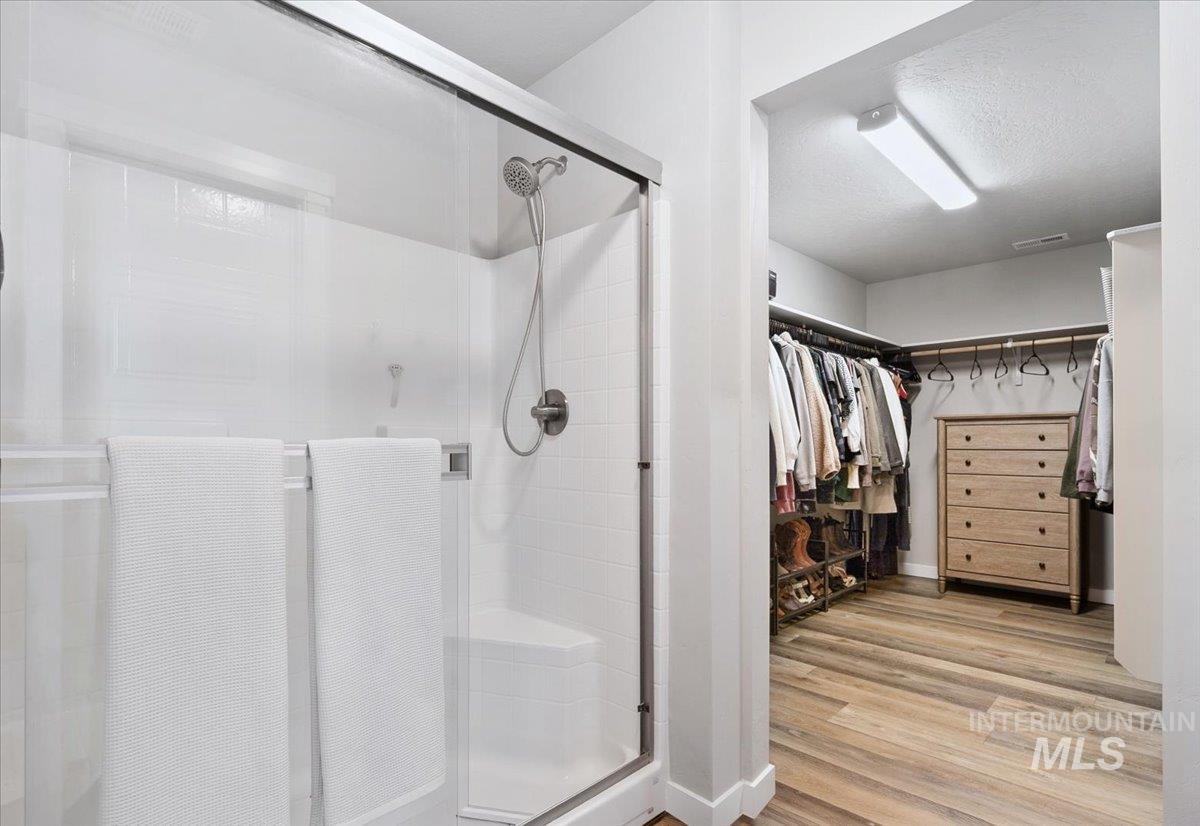 4215 North Pindus Avenue Meridian, ID 83646 - Photo 29 of 46 Bathroom with a spacious closet, LVP, walk-in shower