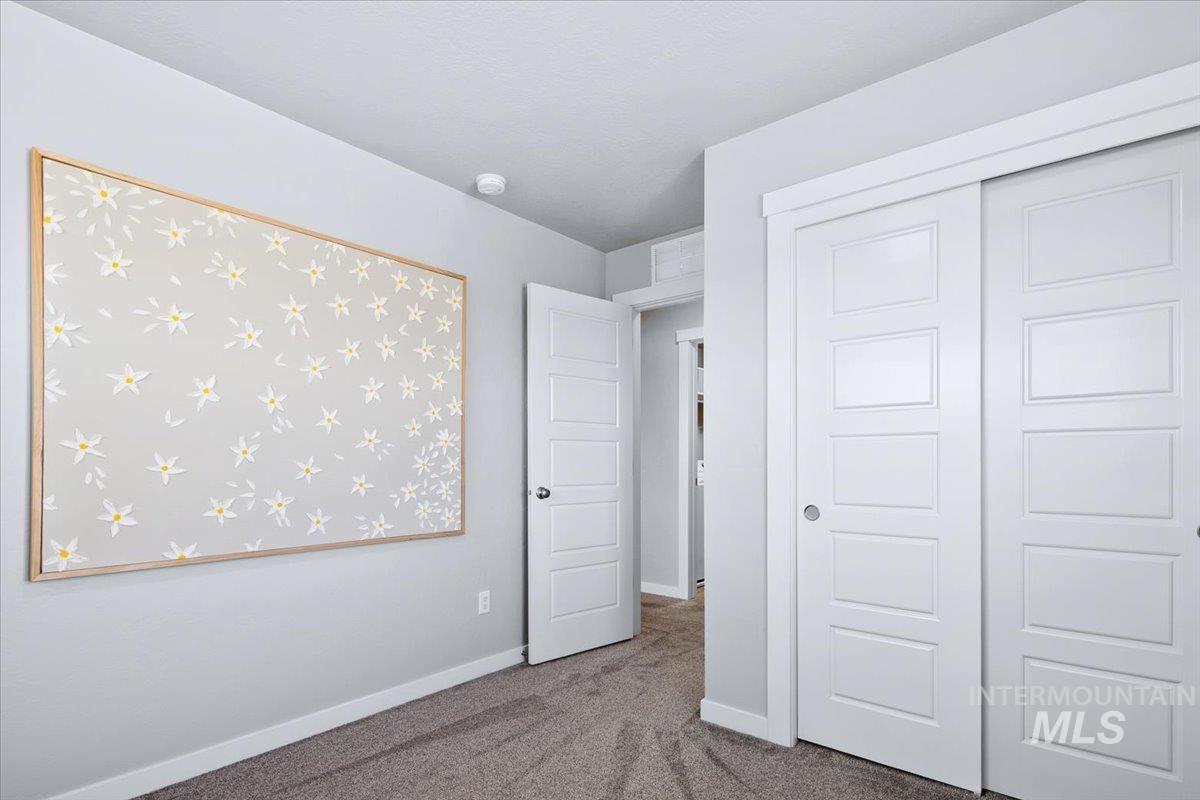 4215 North Pindus Avenue Meridian, ID 83646 - Photo 35 of 46 Bedroom with carpet floors and a closet