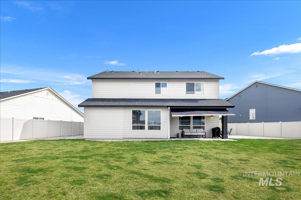 4215 North Pindus Avenue Meridian, ID 83646 - Photo 44 of 46 Back of house with a fenced backyard, a patio area, and outdoor living space
