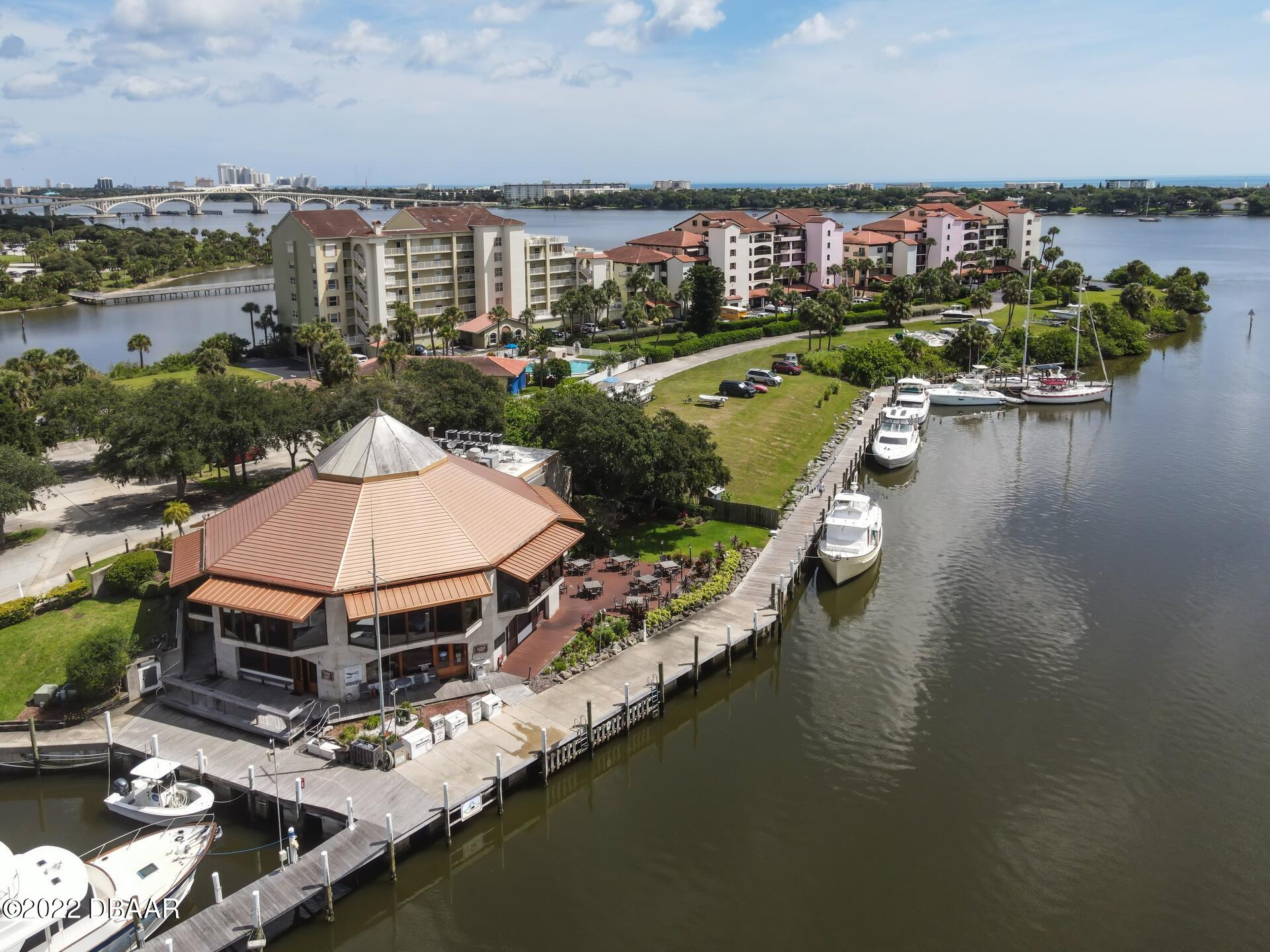 an aerial view of a house with outdoor space lake view and boat