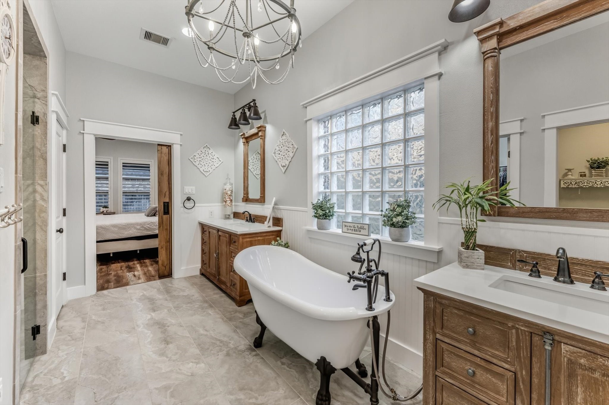 103 Fox Rindle Road Montgomery, TX 77316 - Photo 17 of 44 Dual vanities with designer mirrors and custom finishes provide a polished, spa worthy space for daily routines.