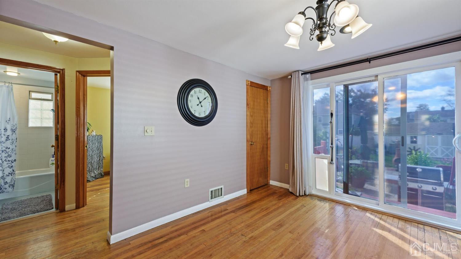21 Highfield Road Colonia, NJ 07067 - Photo 8 of 26 Dining room showing sliding door going to back yard