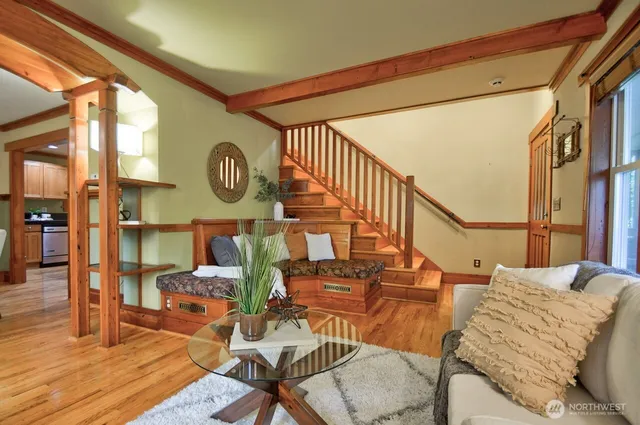 a living room with furniture and a clock