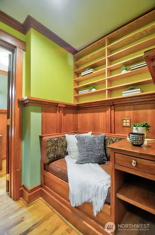 a bedroom with furniture and a window