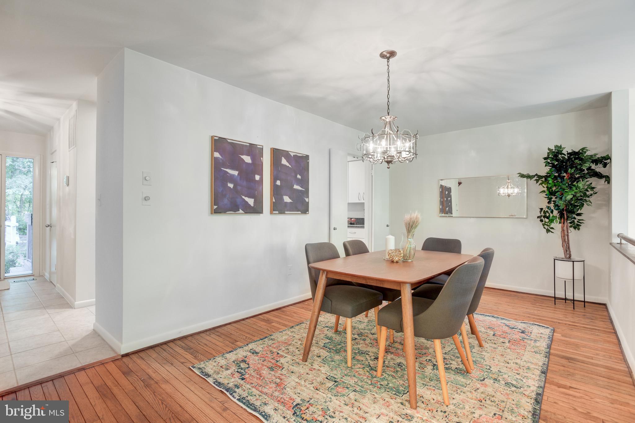 2025 Lakebreeze Way Reston, VA 20191 - Photo 12 of 48 a view of a dining room with furniture window and wooden floor