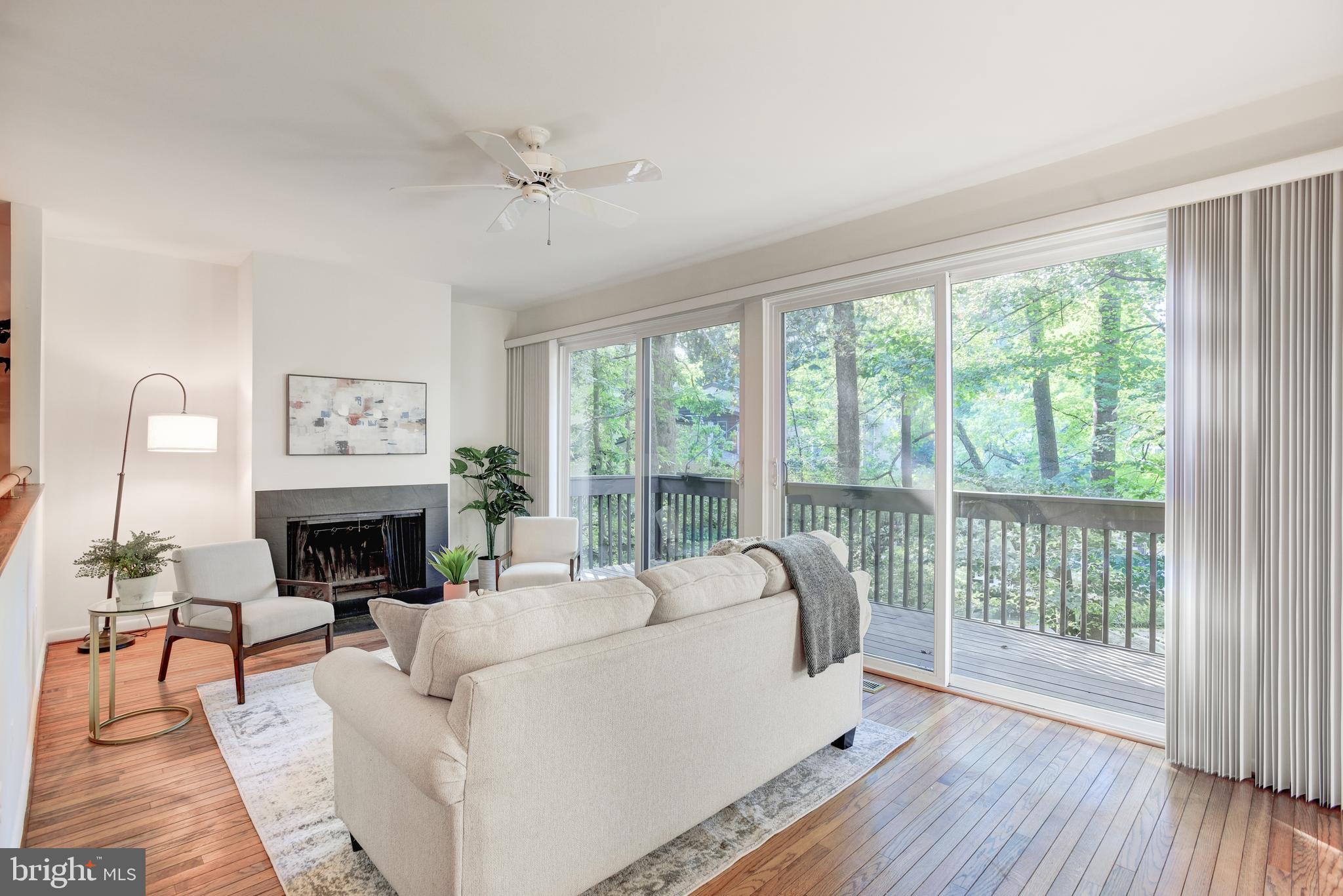 2025 Lakebreeze Way Reston, VA 20191 - Photo 13 of 48 a living room with furniture and a fireplace