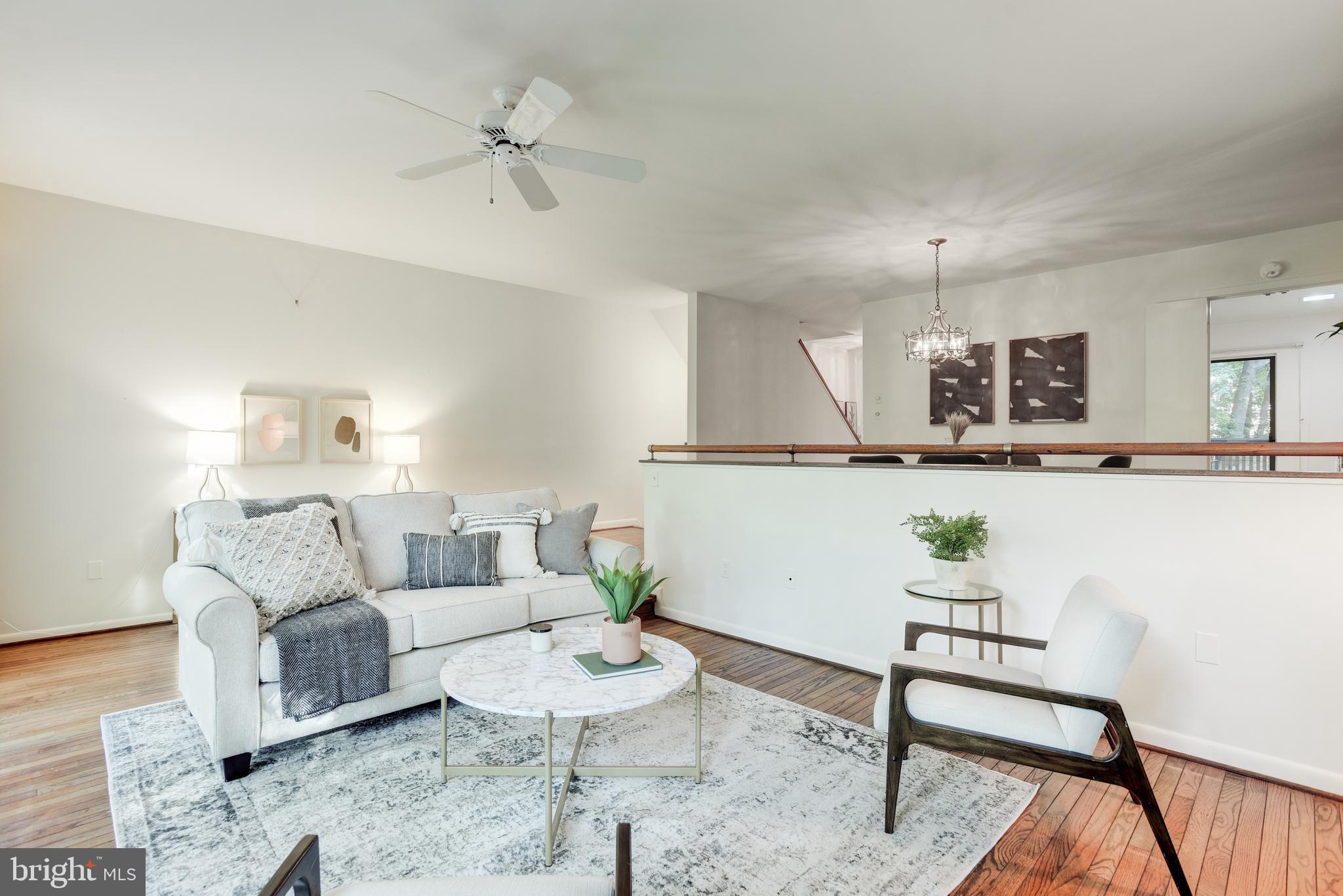 2025 Lakebreeze Way Reston, VA 20191 - Photo 15 of 48 a living room with furniture and a wooden floor