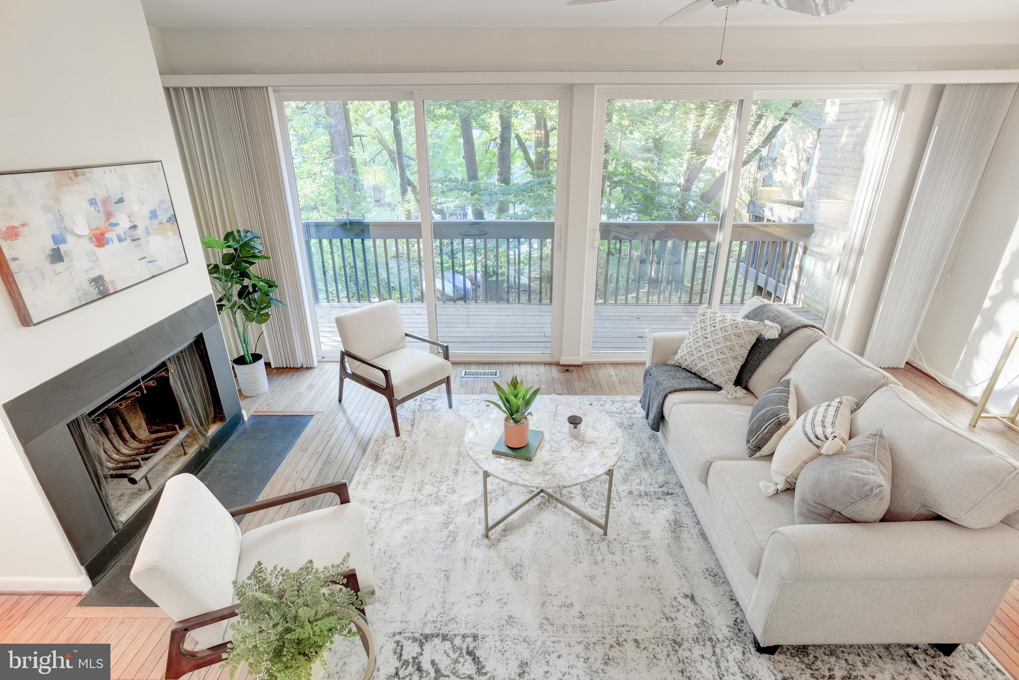 2025 Lakebreeze Way Reston, VA 20191 - Photo 16 of 48 a living room with furniture and a large window