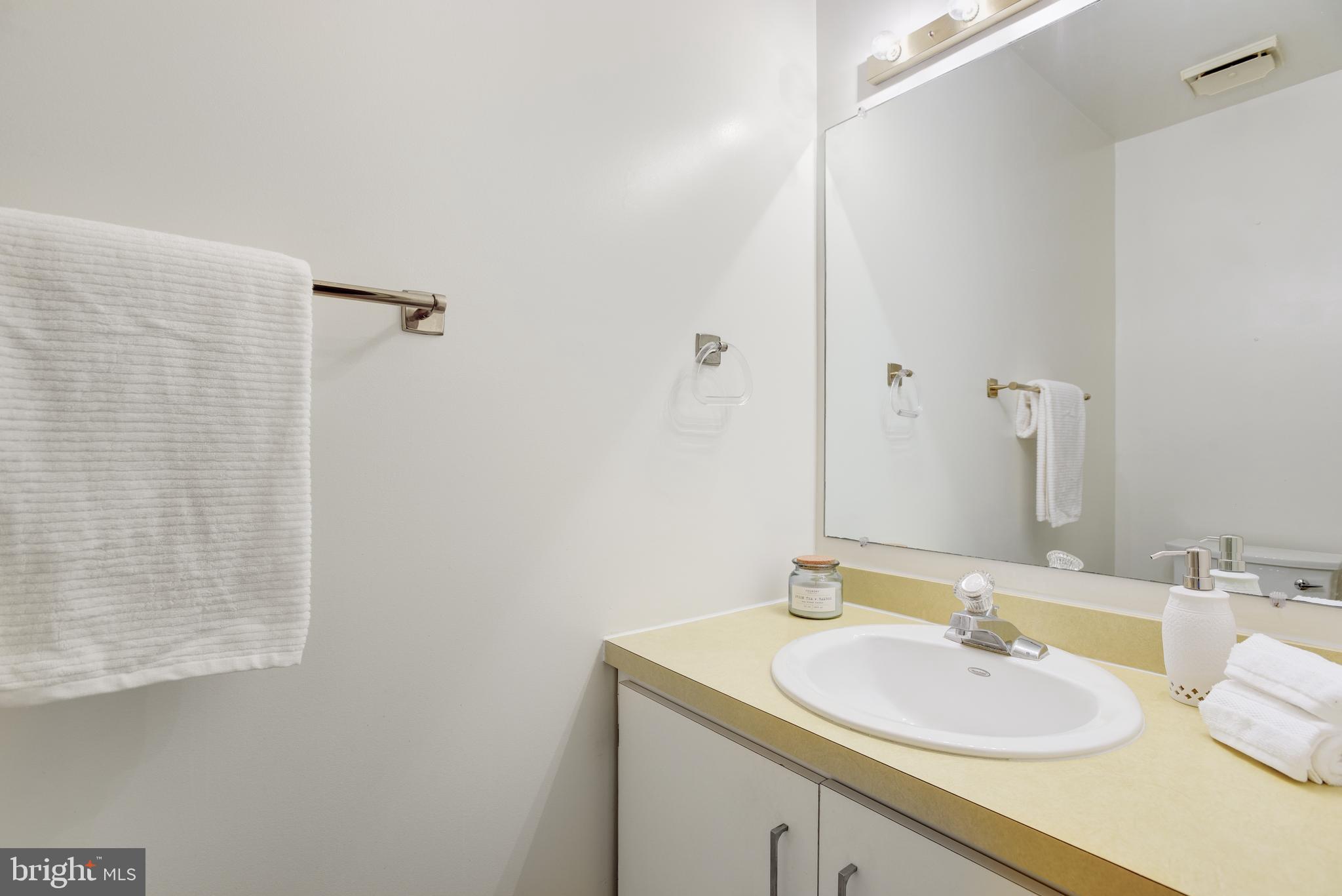 2025 Lakebreeze Way Reston, VA 20191 - Photo 17 of 48 a bathroom with a sink and a mirror