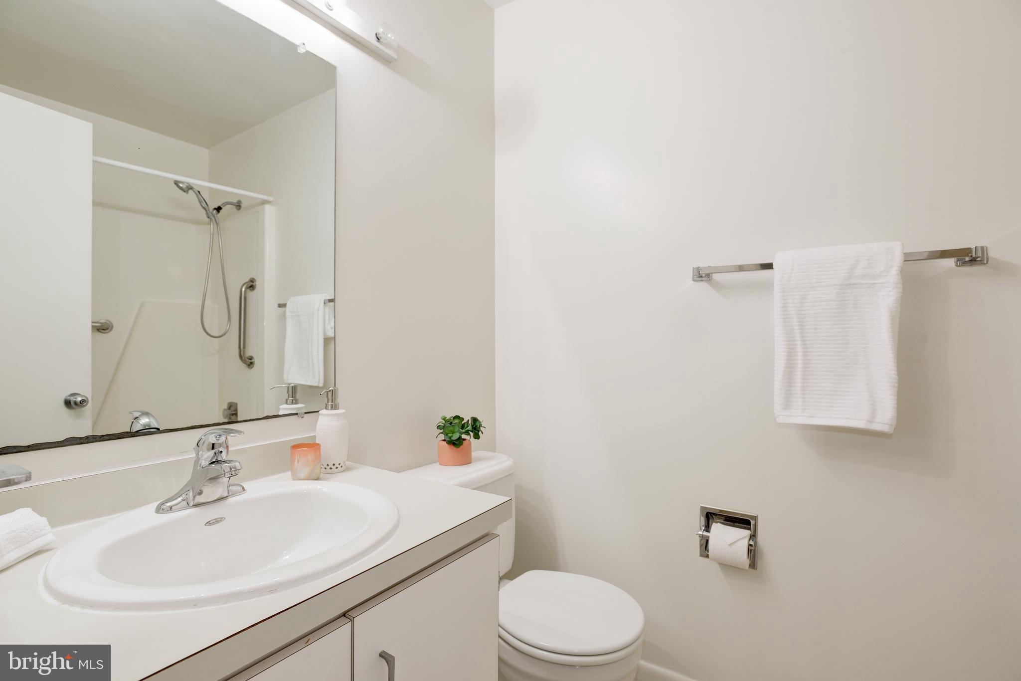2025 Lakebreeze Way Reston, VA 20191 - Photo 25 of 48 a bathroom with a sink toilet and shower