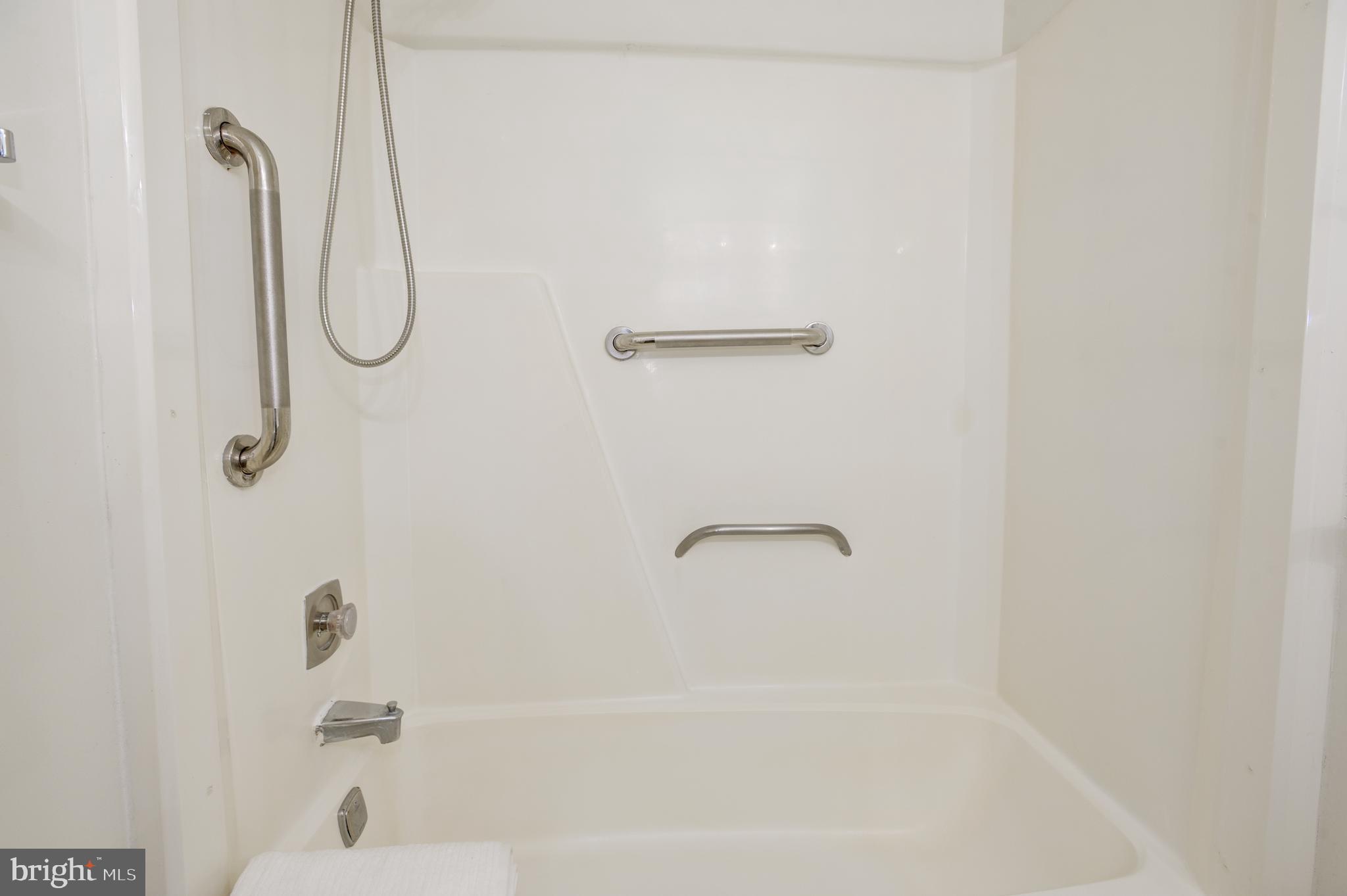2025 Lakebreeze Way Reston, VA 20191 - Photo 26 of 48 a bathroom with a bath tub with a shower