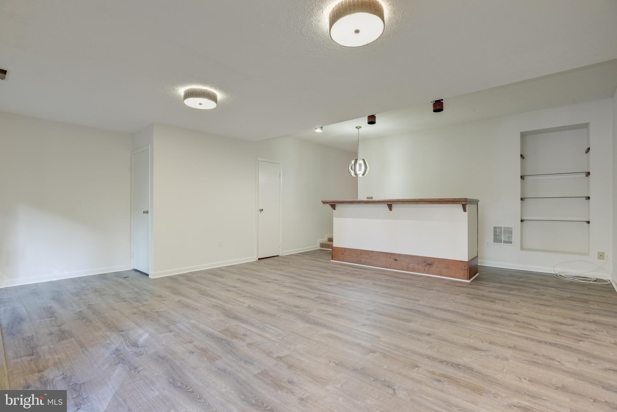 2025 Lakebreeze Way Reston, VA 20191 - Photo 29 of 48 a view of a livingroom with wooden floor
