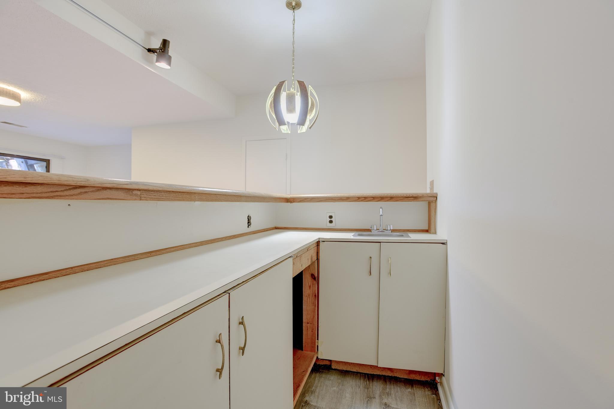 2025 Lakebreeze Way Reston, VA 20191 - Photo 31 of 48 a utility room with cabinets and washer