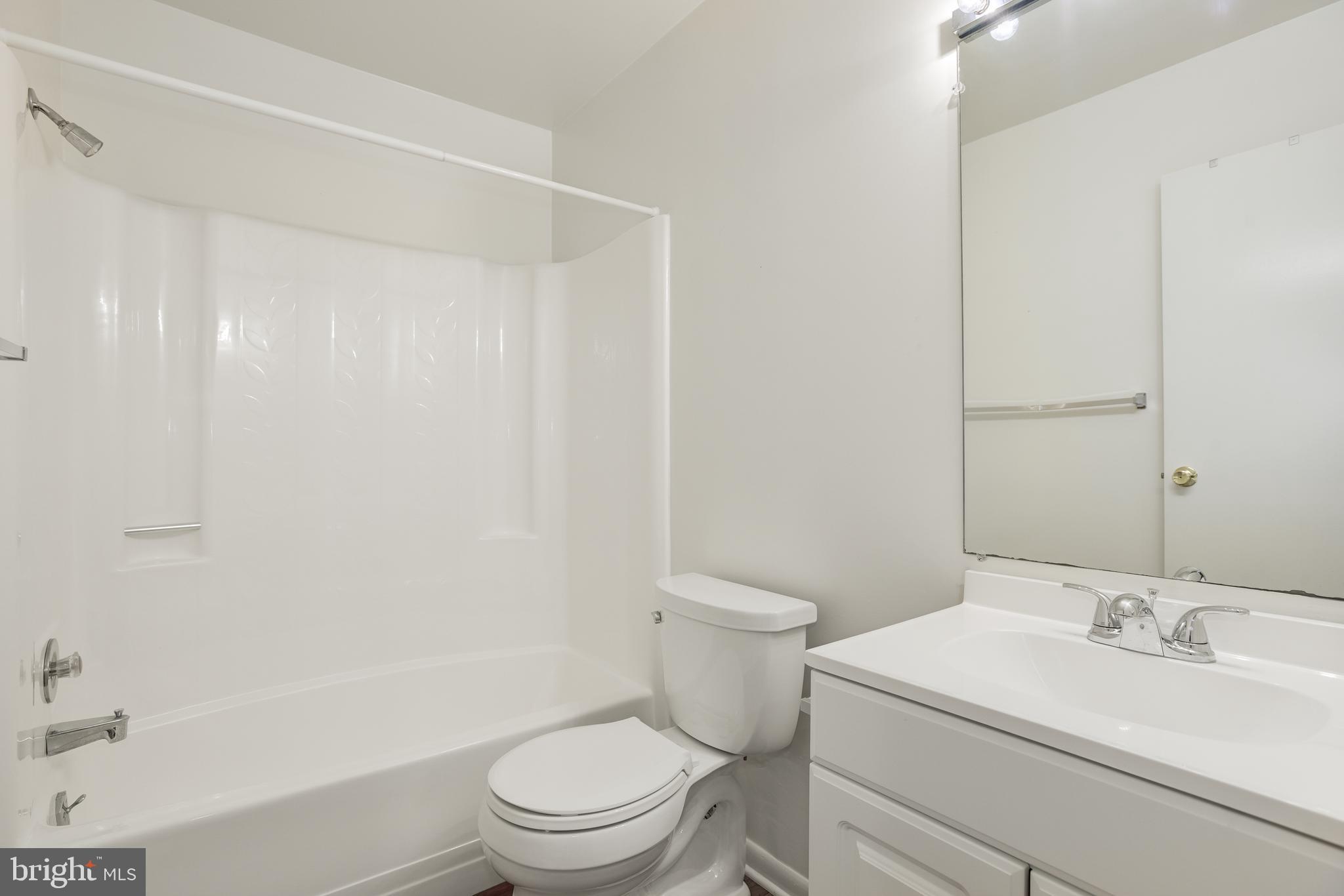 2025 Lakebreeze Way Reston, VA 20191 - Photo 32 of 48 a bathroom with a sink a toilet and shower