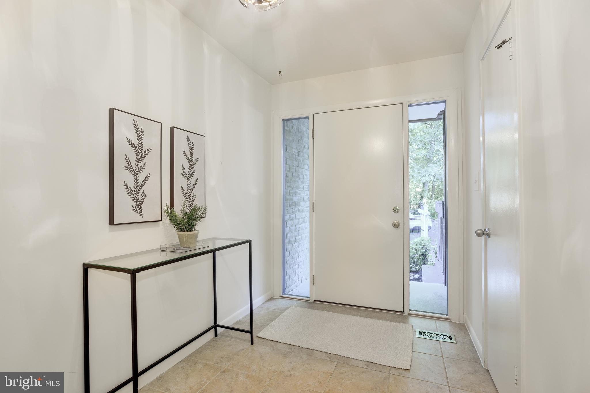 2025 Lakebreeze Way Reston, VA 20191 - Photo 4 of 48 a view of an empty room with painting on the wall
