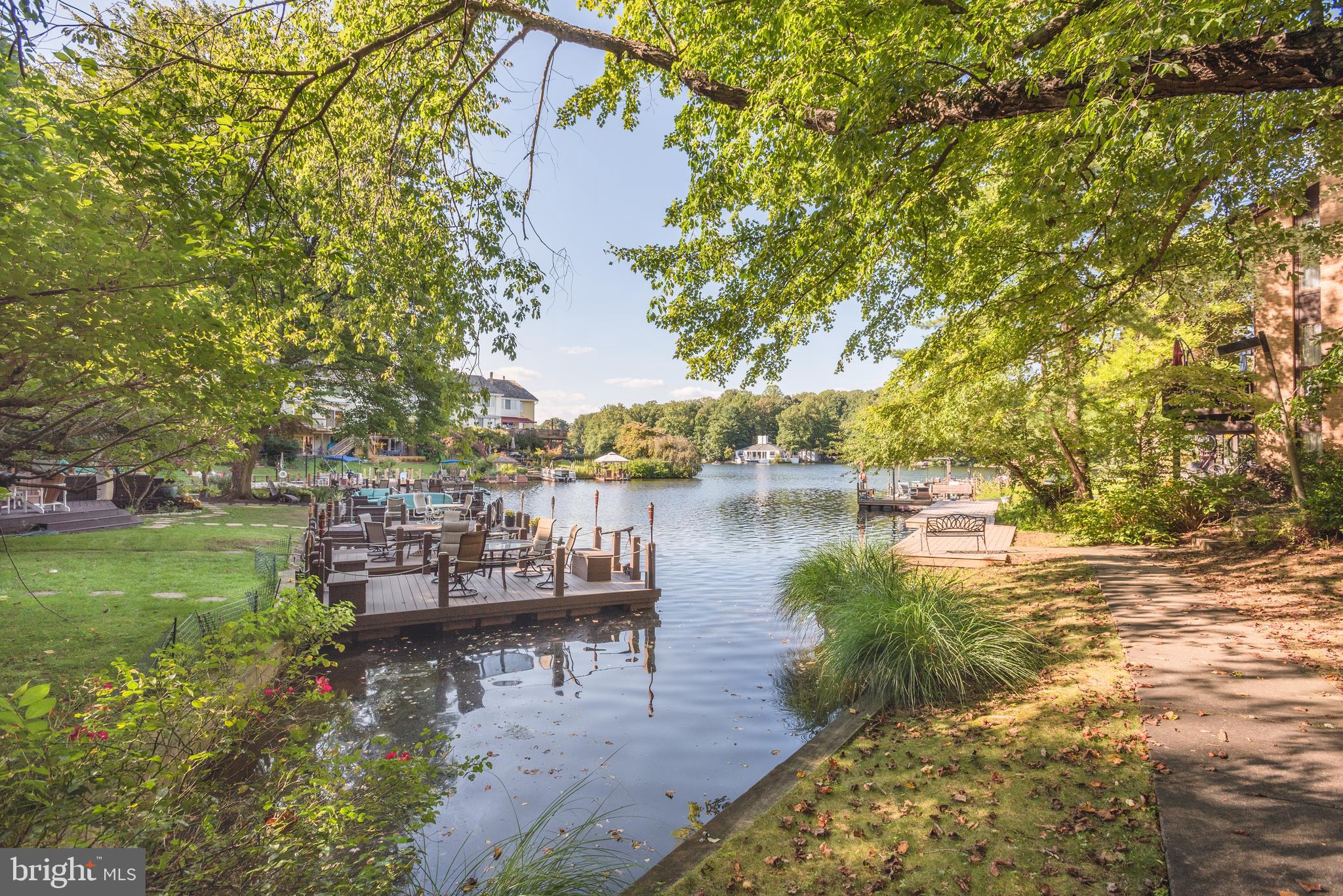 2025 Lakebreeze Way Reston, VA 20191 - Photo 46 of 48 a view of a lake with houses in front of house