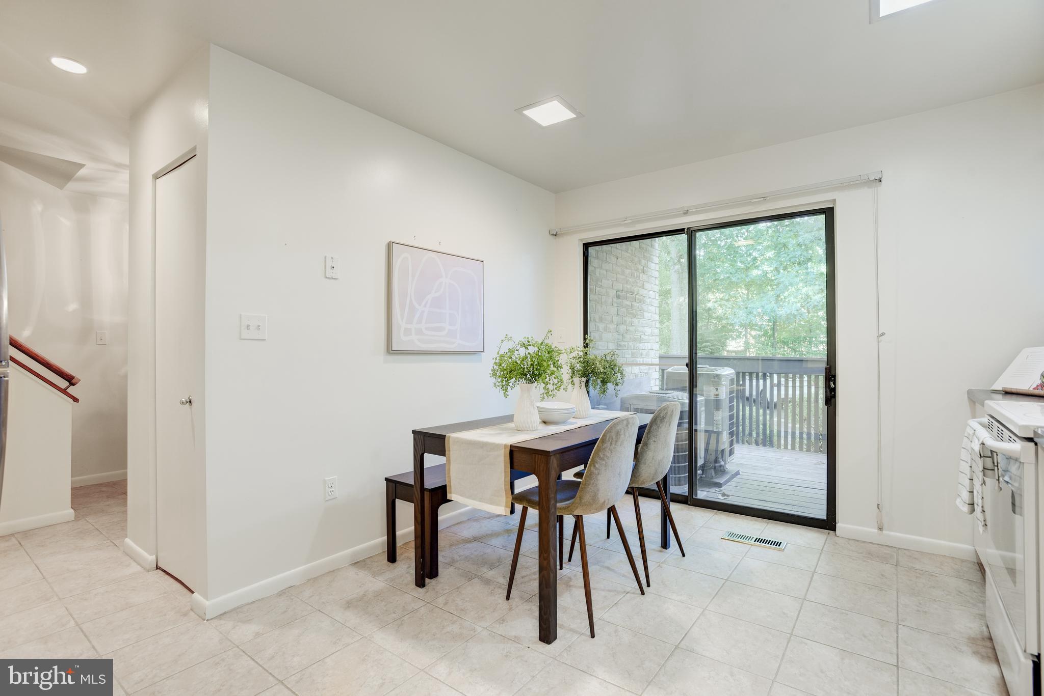 2025 Lakebreeze Way Reston, VA 20191 - Photo 8 of 48 a view of a dining room with furniture window and outside view