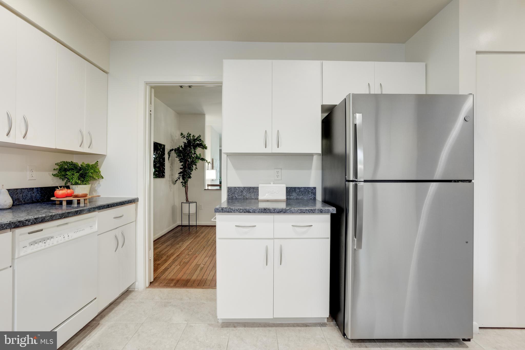 2025 Lakebreeze Way Reston, VA 20191 - Photo 10 of 48 a kitchen with a refrigerator and a sink