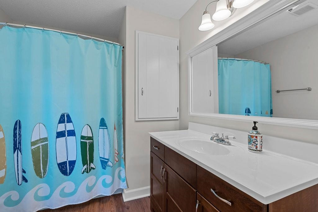 5208 Rivington Road Fuquay-Varina, NC 27526 - Photo 15 of 30 Full Bath with Hardwood Style Laminate Floors that are Seen Throughout Most of this Home