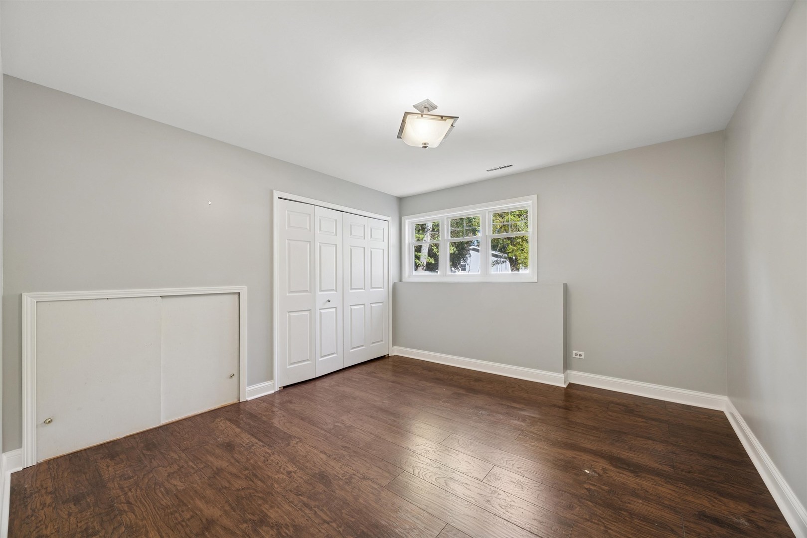 1116 Hidden Spring Drive Naperville, IL 60540 - Photo 12 of 32 an empty room with wooden floor chandelier and windows