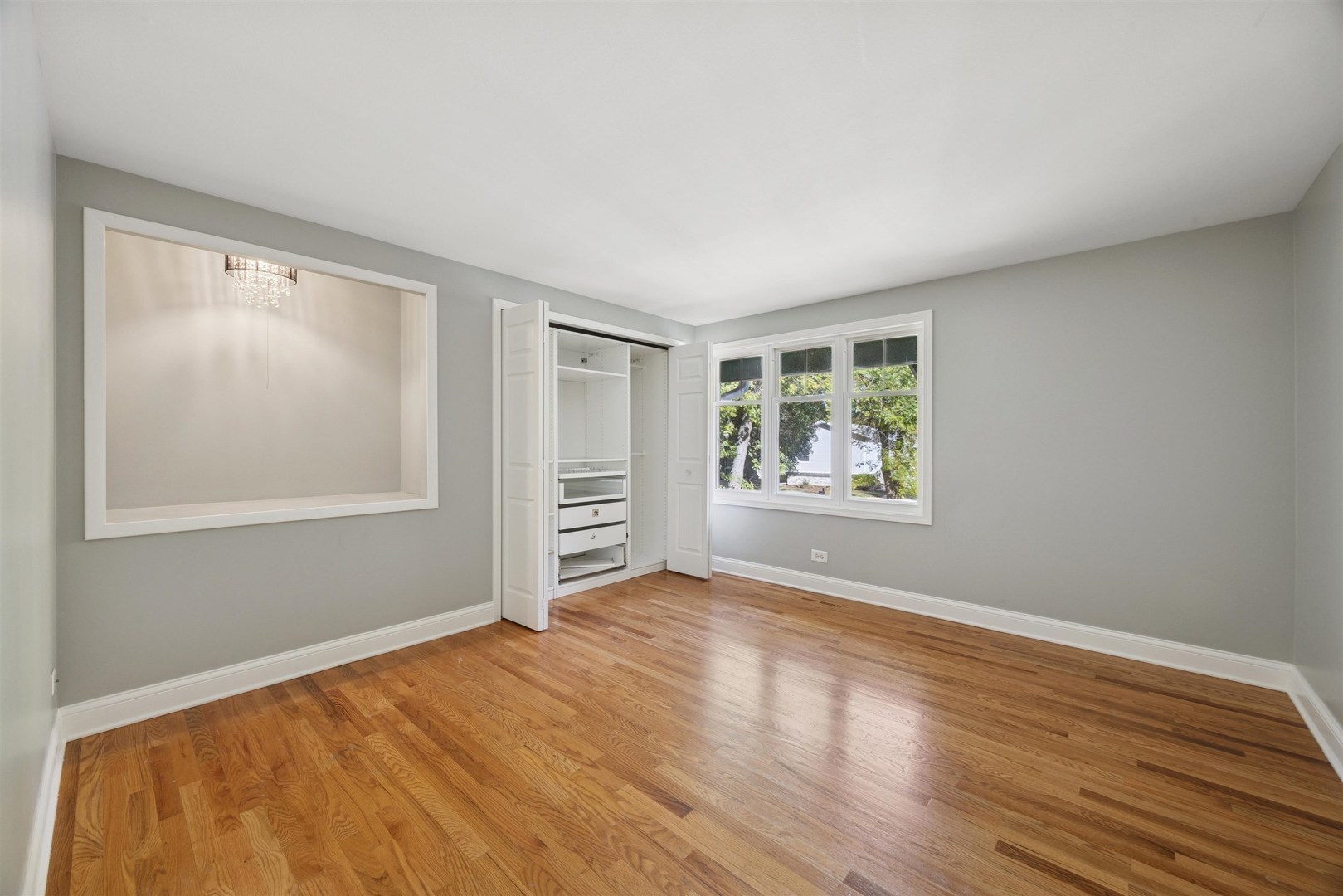 1116 Hidden Spring Drive Naperville, IL 60540 - Photo 19 of 32 a view of room with window and hardwood floor