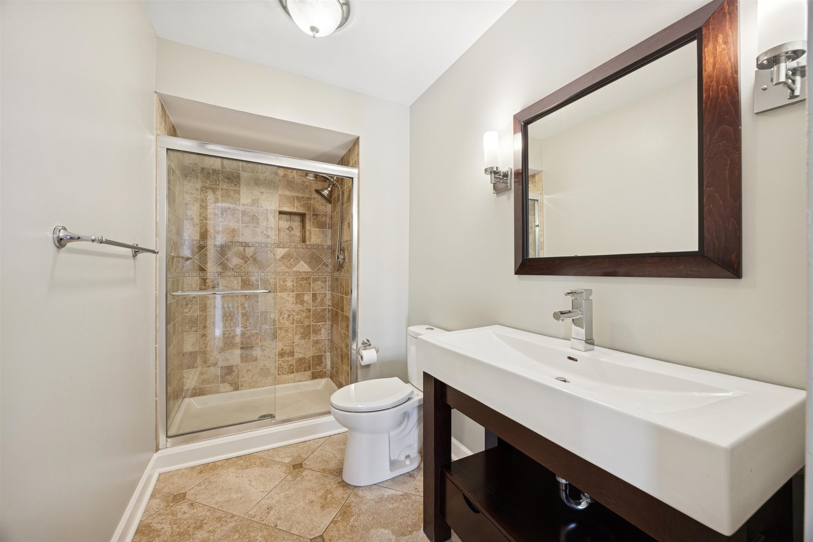 1116 Hidden Spring Drive Naperville, IL 60540 - Photo 21 of 32 a bathroom with a sink a toilet and shower