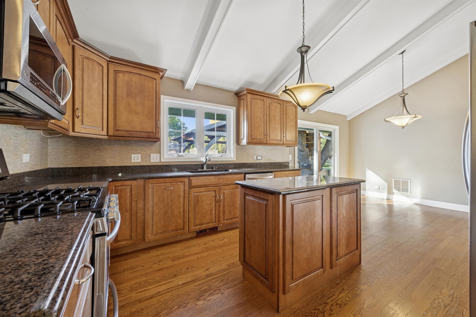 1116 Hidden Spring Drive Naperville, IL 60540 - Photo 5 of 32 a kitchen with granite countertop a sink and cabinets
