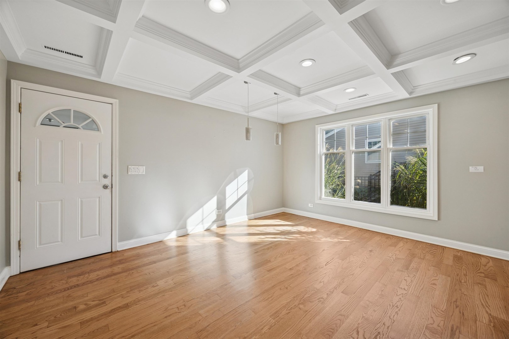 1116 Hidden Spring Drive Naperville, IL 60540 - Photo 9 of 32 a view of empty room with wooden floor and fan
