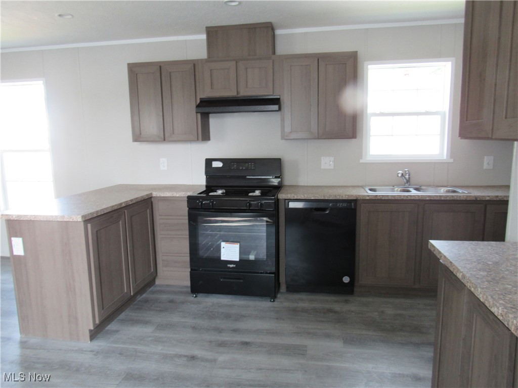 30 Kyle Lane Akron, OH 44310 - Photo 14 of 23 Kitchen with sink, light hardwood / wood-style flooring, and black appliances