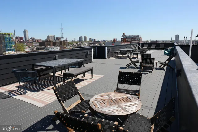 a view of a terrace with furniture and rug
